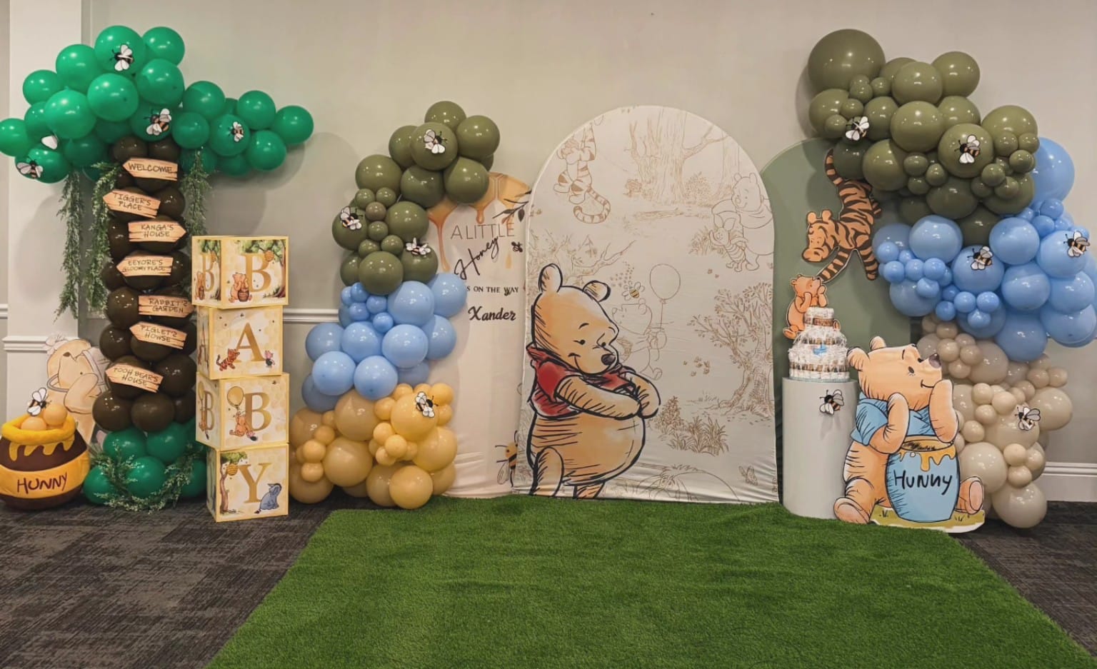 Winnie the Pooh baby shower balloon decoration with custom woodland backdrop by AABallons